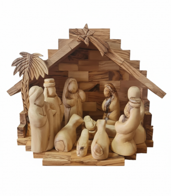 Olive wood nativity set with hand-carved figures, wooden barn stable, and palm leaves from Bethlehem