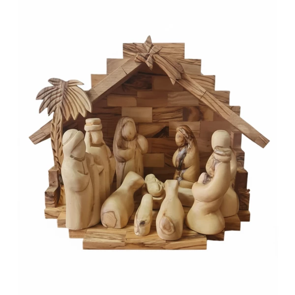 Olive wood nativity set with hand-carved figures, wooden barn stable, and palm leaves from Bethlehem
