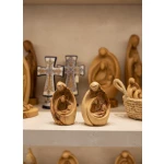 Close-up detail of Mary baby Jesus figurine showing fine hand-carved bethlehem wood carving