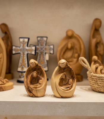 Close-up detail of Mary baby Jesus figurine showing fine hand-carved bethlehem wood carving