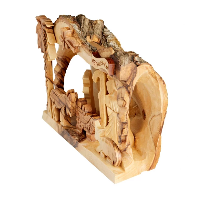 Close-up detail of hand-carved nativity figures showing wooden carving artistry