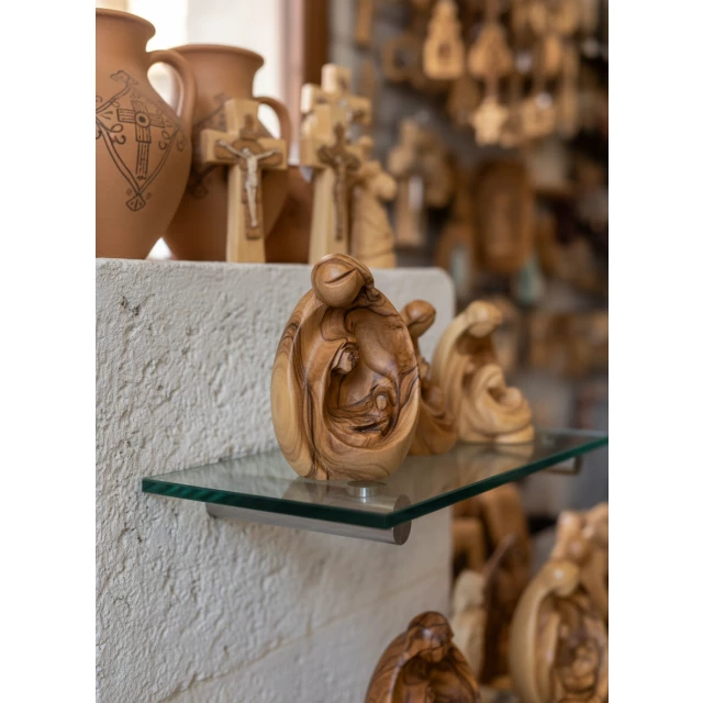 Mary baby Jesus figurine displayed as spiritual gift and bethlehem religious wood carving art