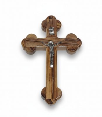 Wooden crucifix for wall with rounded trefoil ends and silver corpus on white background